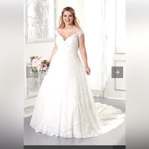 New, never altered wedding dress with tags